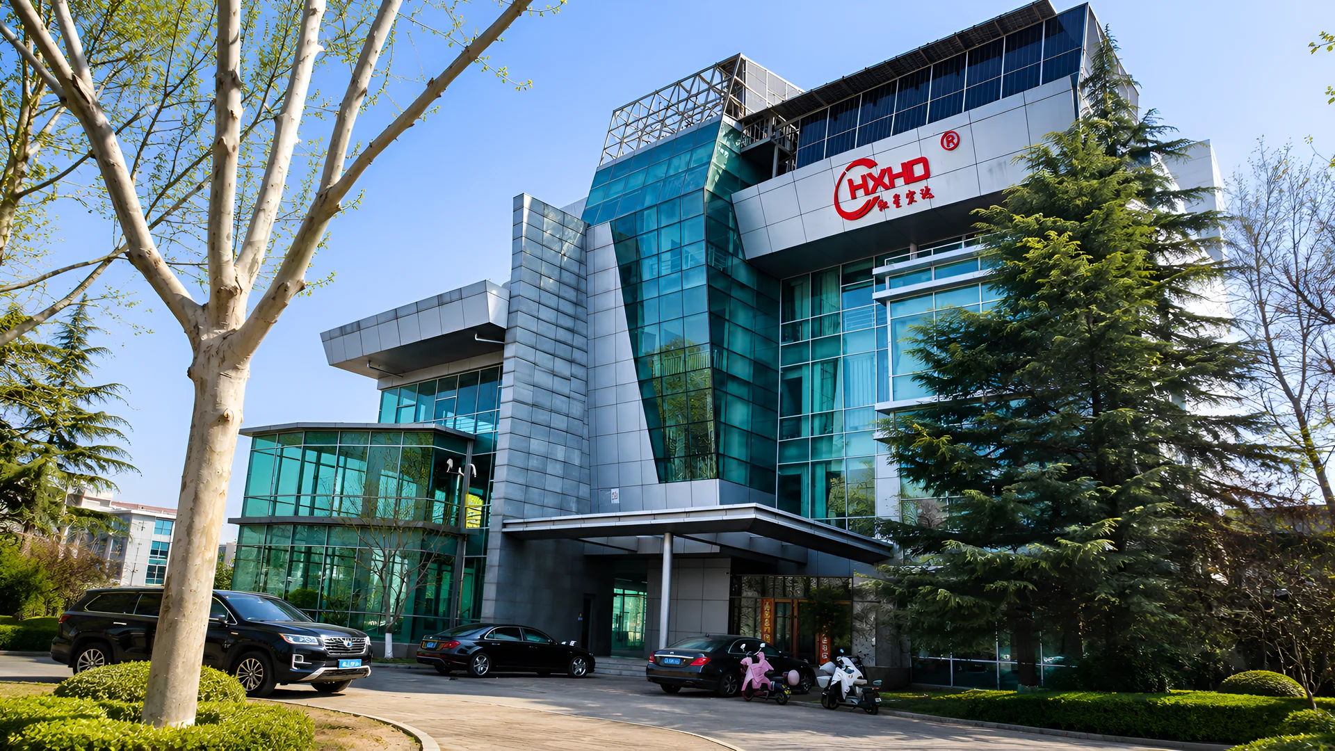 HXHD head office in Beijing, glass-fronted and carrying the company sign